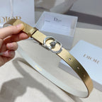 Gold leather belt strap with silver buckle loop and crystal bezel