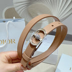 Tan leather belt with silver buckle and round jeweled detail
