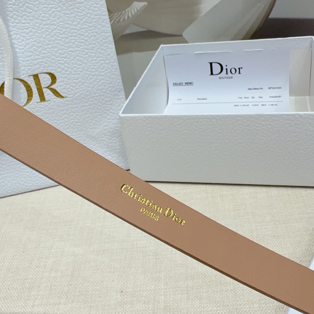Tan leather belt with Christian Dior embossed script on the strap