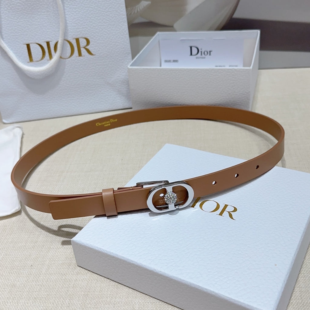 Tan leather belt with silver buckle and gem-set oval ring