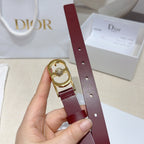 Burgundy leather belt strap with punched holes and gold-tone buckle with crystal