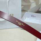 Burgundy leather belt with gold buckle and “Christian Dior Paris” embossing