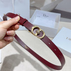 Burgundy leather belt with gold-tone buckle, crystal charm, and punched holes