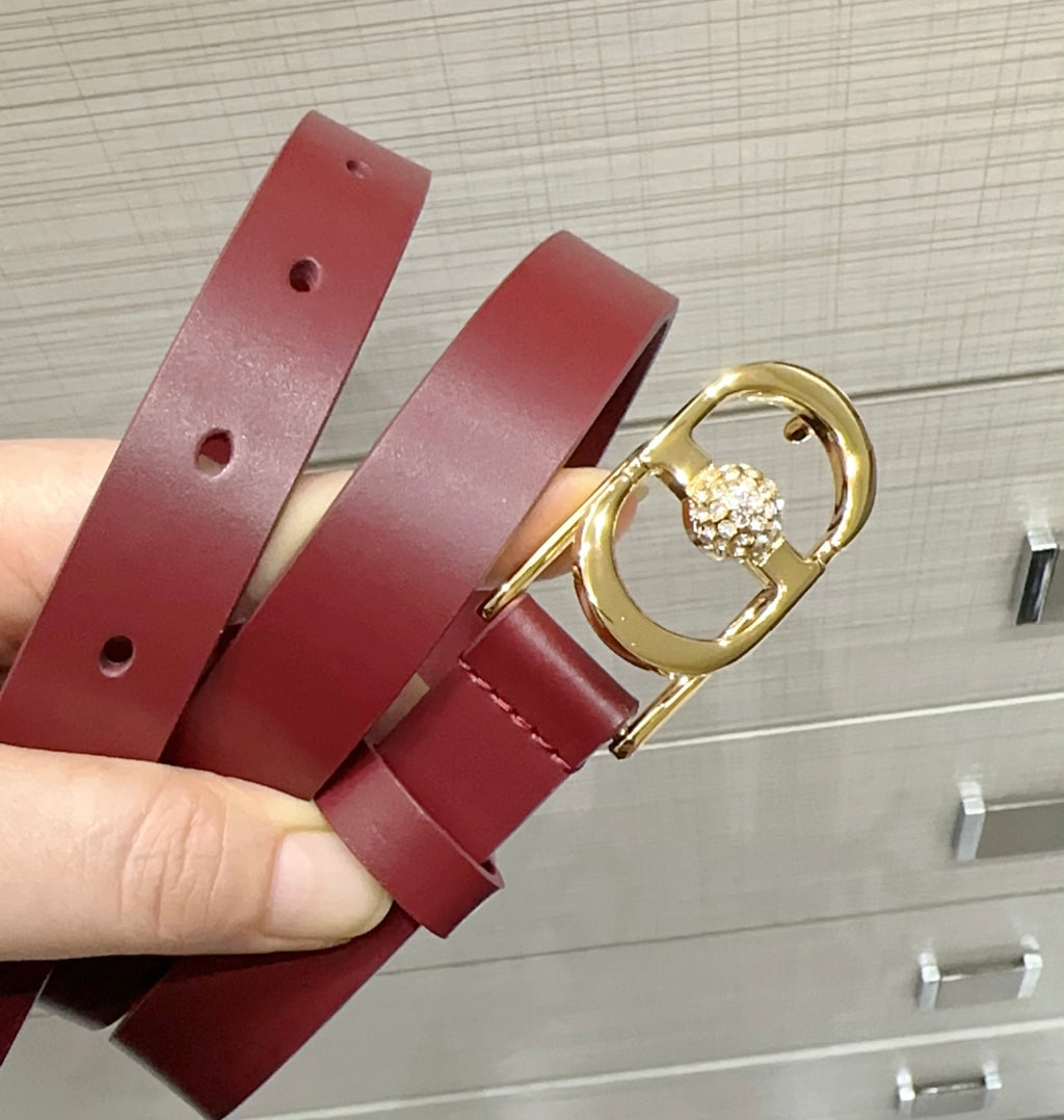 Burgundy leather belt with gold-tone buckle and small crystal heart detail
