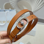 Tan leather belt with silver buckle and center crystal accent