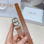 Tan leather belt close-up with silver buckle loop and center crystal