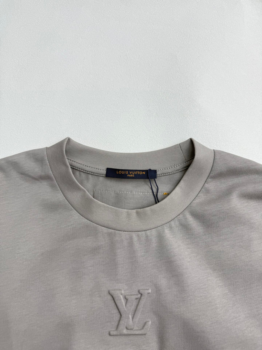 Light gray crew-neck T-shirt with small LV monogram on chest
