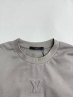 Light gray crew-neck T-shirt with small LV monogram on chest