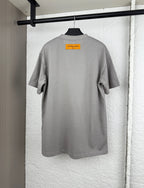 Light gray short-sleeve T-shirt, back view with orange size label