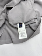 Light gray T-shirt with interior neck and care label visible
