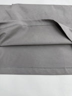 Light gray T-shirt fabric with stitched hem and side seam detail