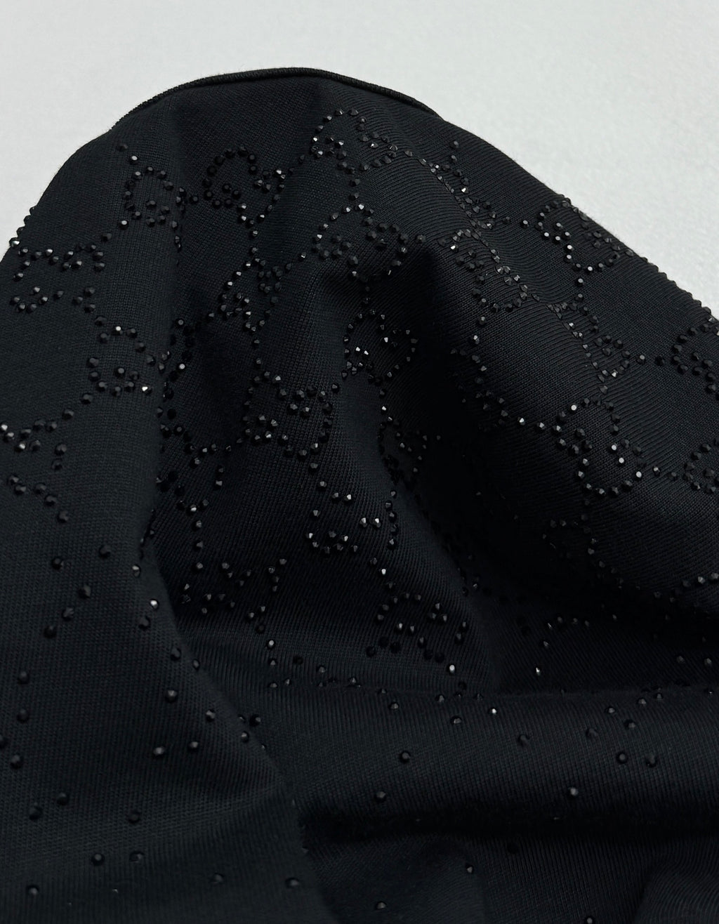 Black T-shirt with raised logo motif detail