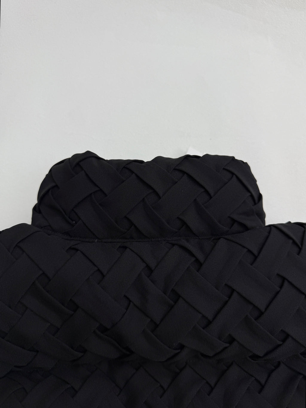Black woven-texture hooded jacket back with quilted detail