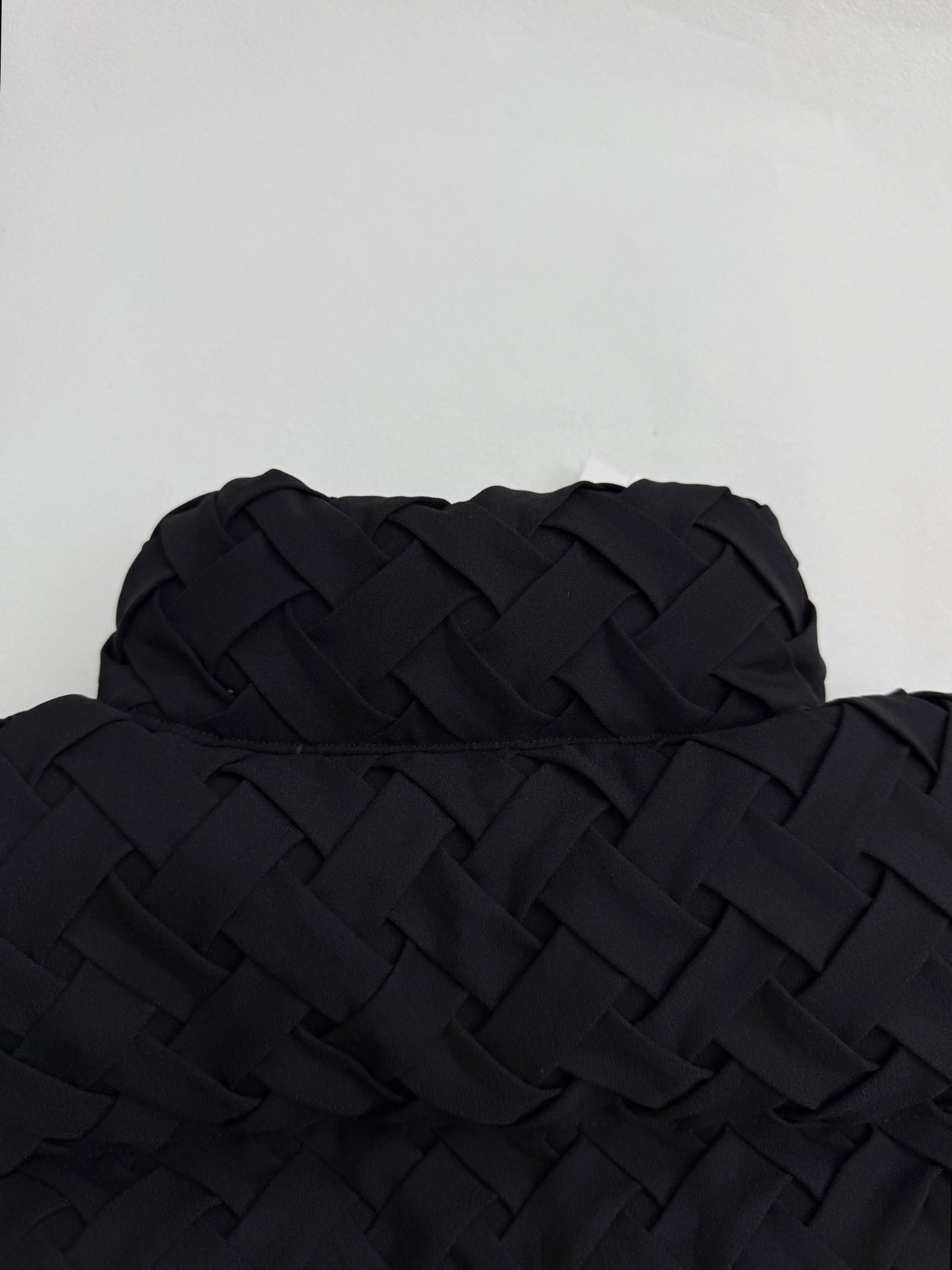Black woven-texture hooded jacket back with quilted detail