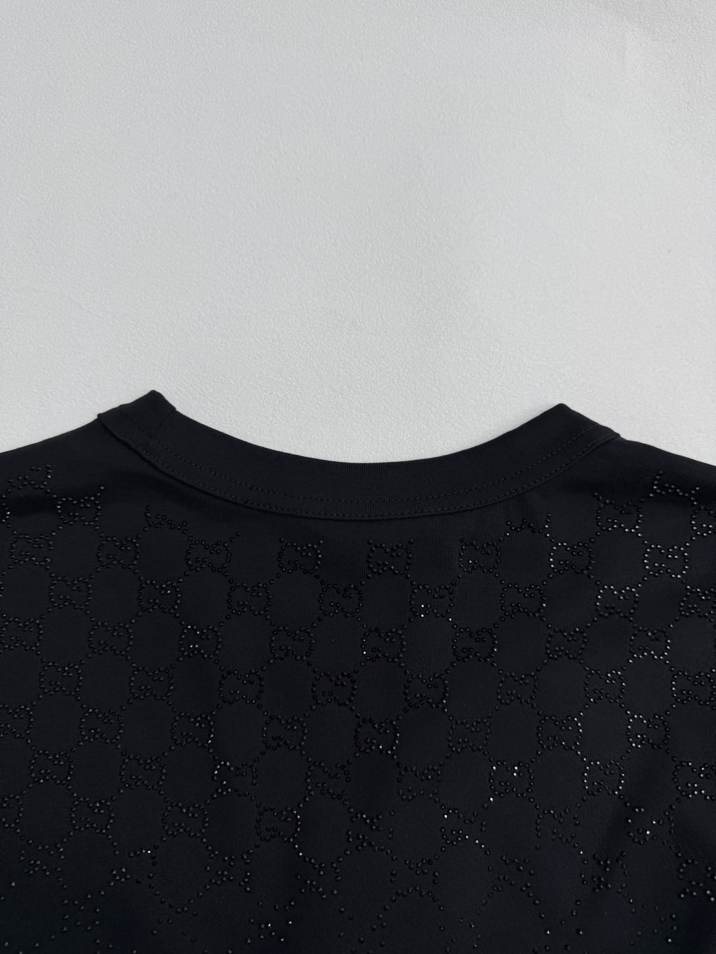 Black short-sleeve T-shirt back neckline with logo print