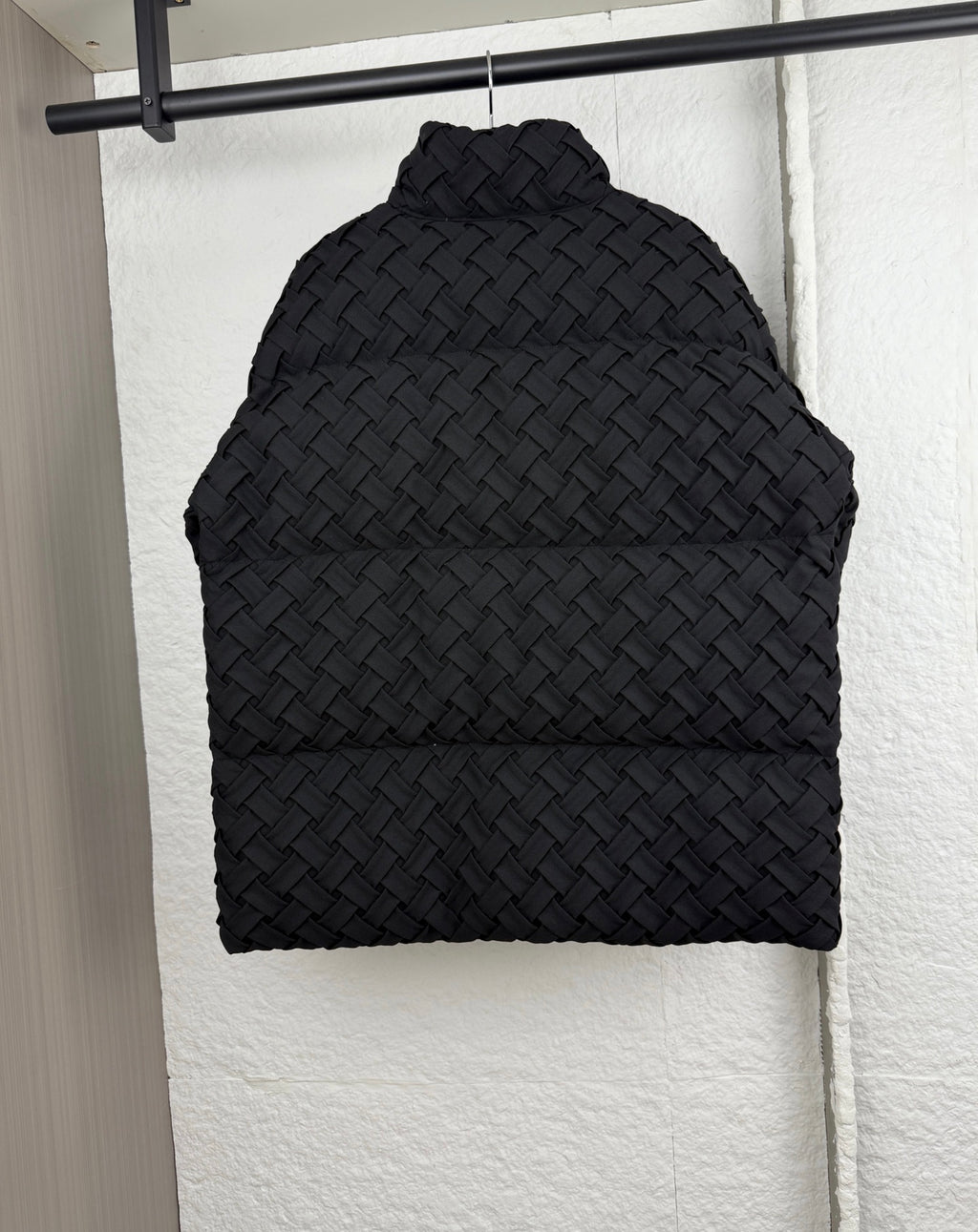Black woven-texture hood with rounded shape