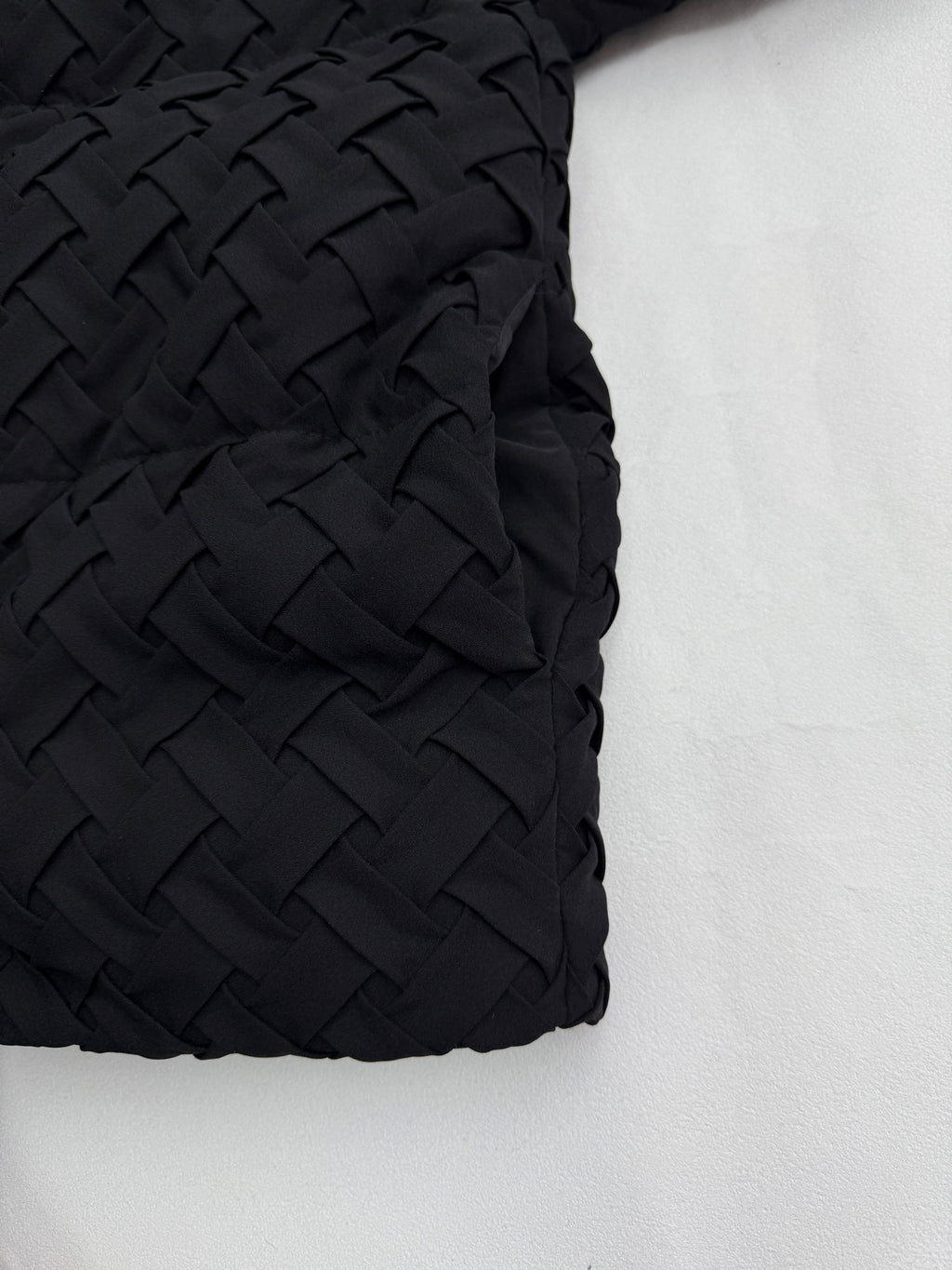 Black woven-texture sleeve panel