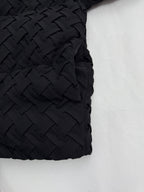 Black woven-texture sleeve panel