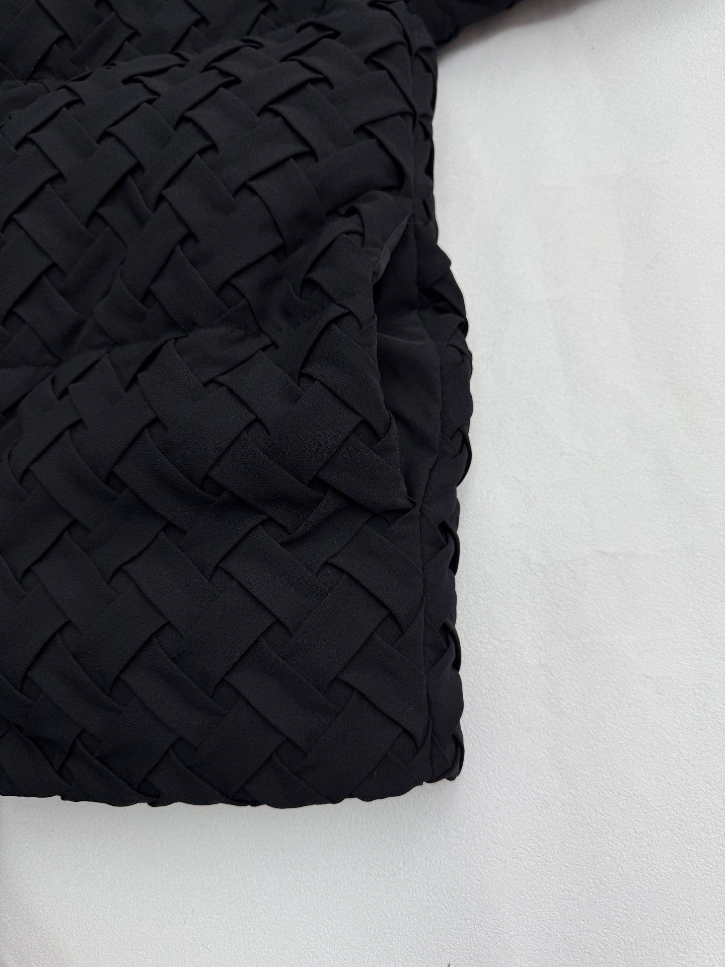 Black woven-texture sleeve panel