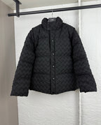 Black woven-texture hooded puffer jacket with front snap buttons