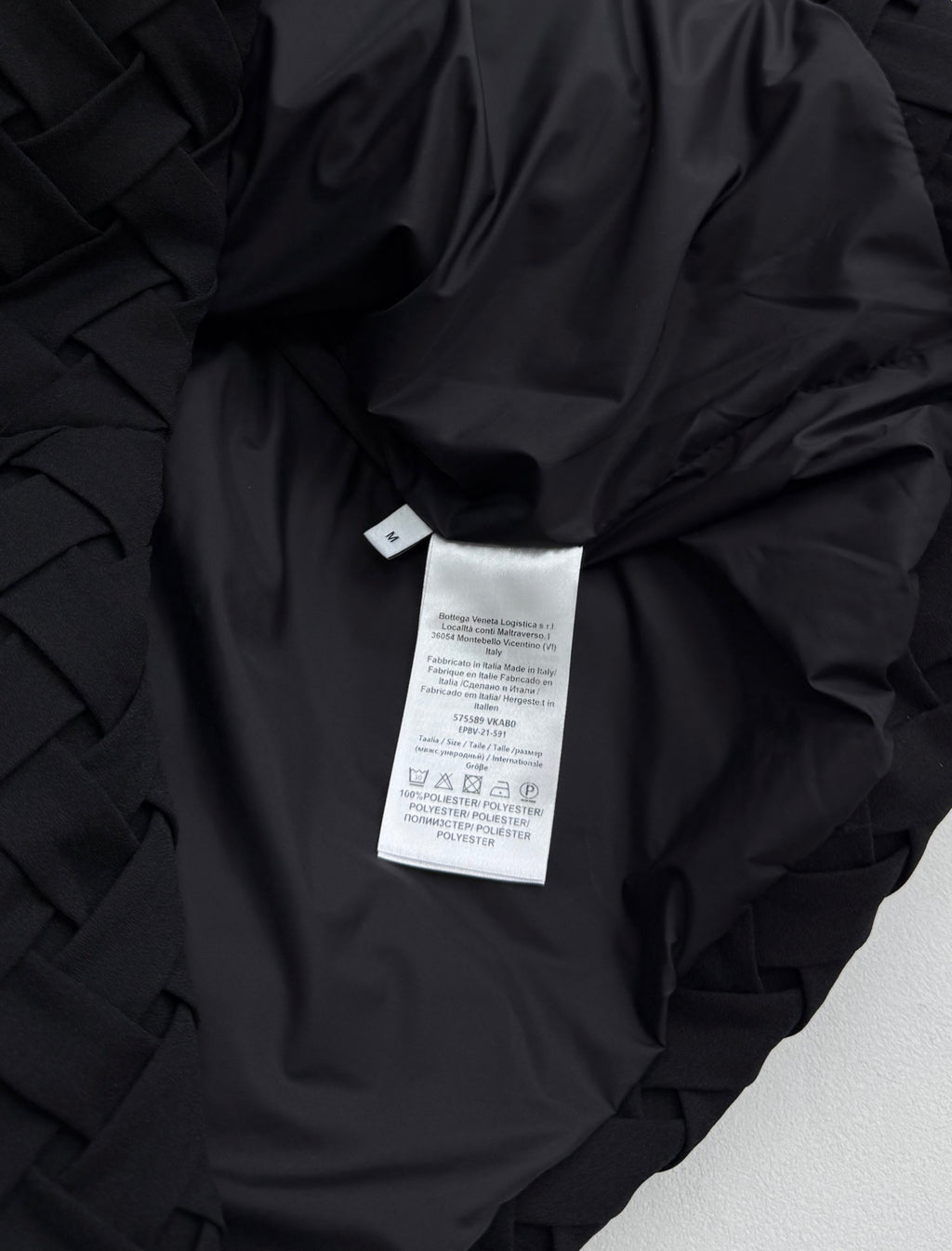 Black jacket interior with care label tag