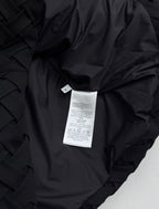 Black jacket interior with care label tag