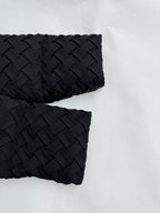 Black hooded jacket sleeves with textured woven pattern