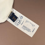 White T-shirt neck tag with care icons and size text