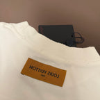 White Louis Vuitton T-shirt with orange inside neck logo label