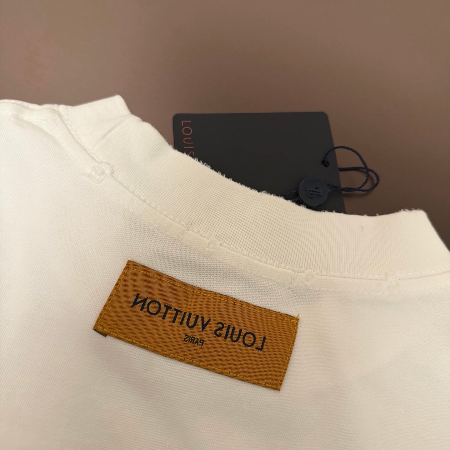 White Louis Vuitton T-shirt with orange inside neck logo label