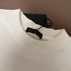 White Louis Vuitton T-shirt neckline close-up with neck label and tag