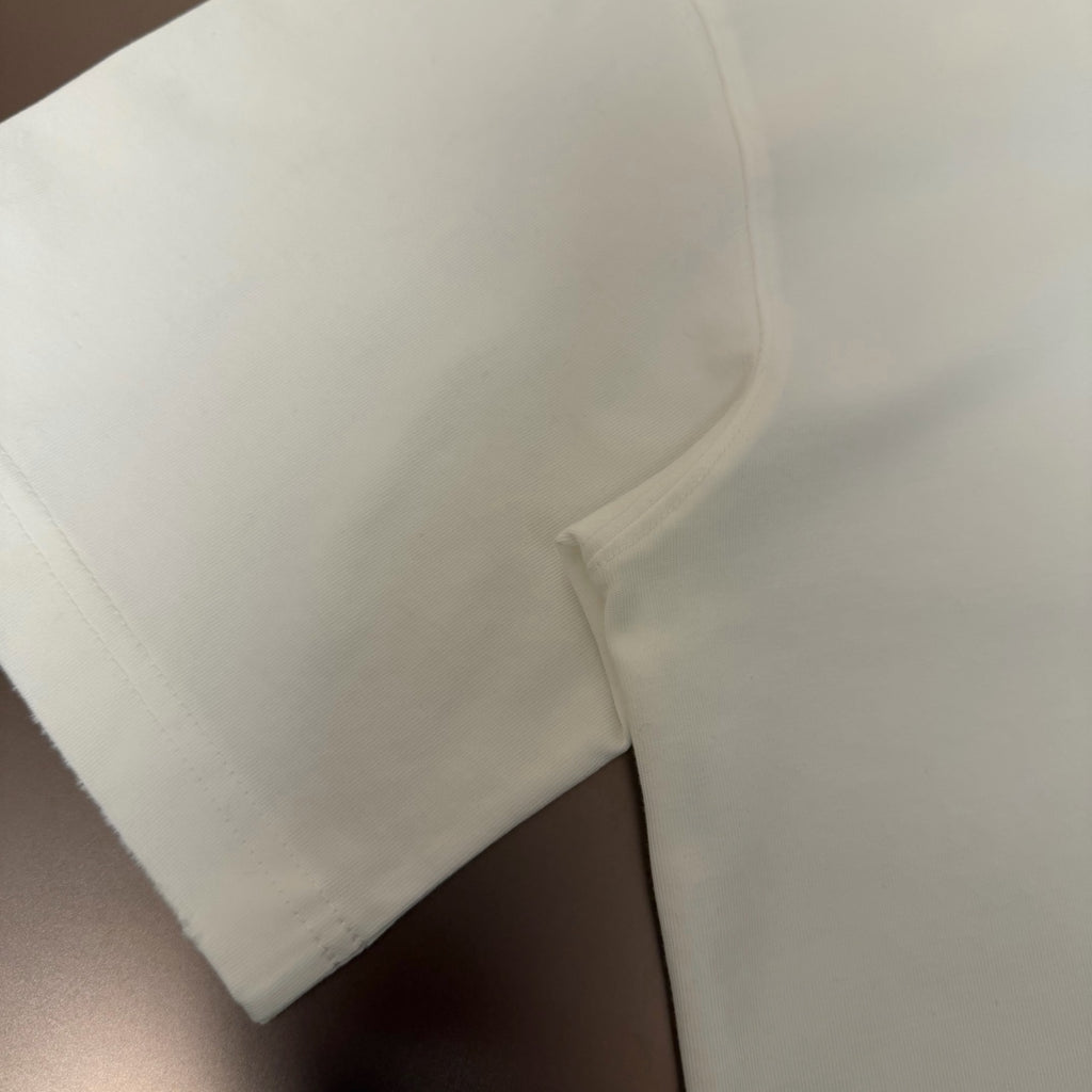 White T-shirt curved hem and side seam close-up