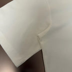 White T-shirt curved hem and side seam close-up