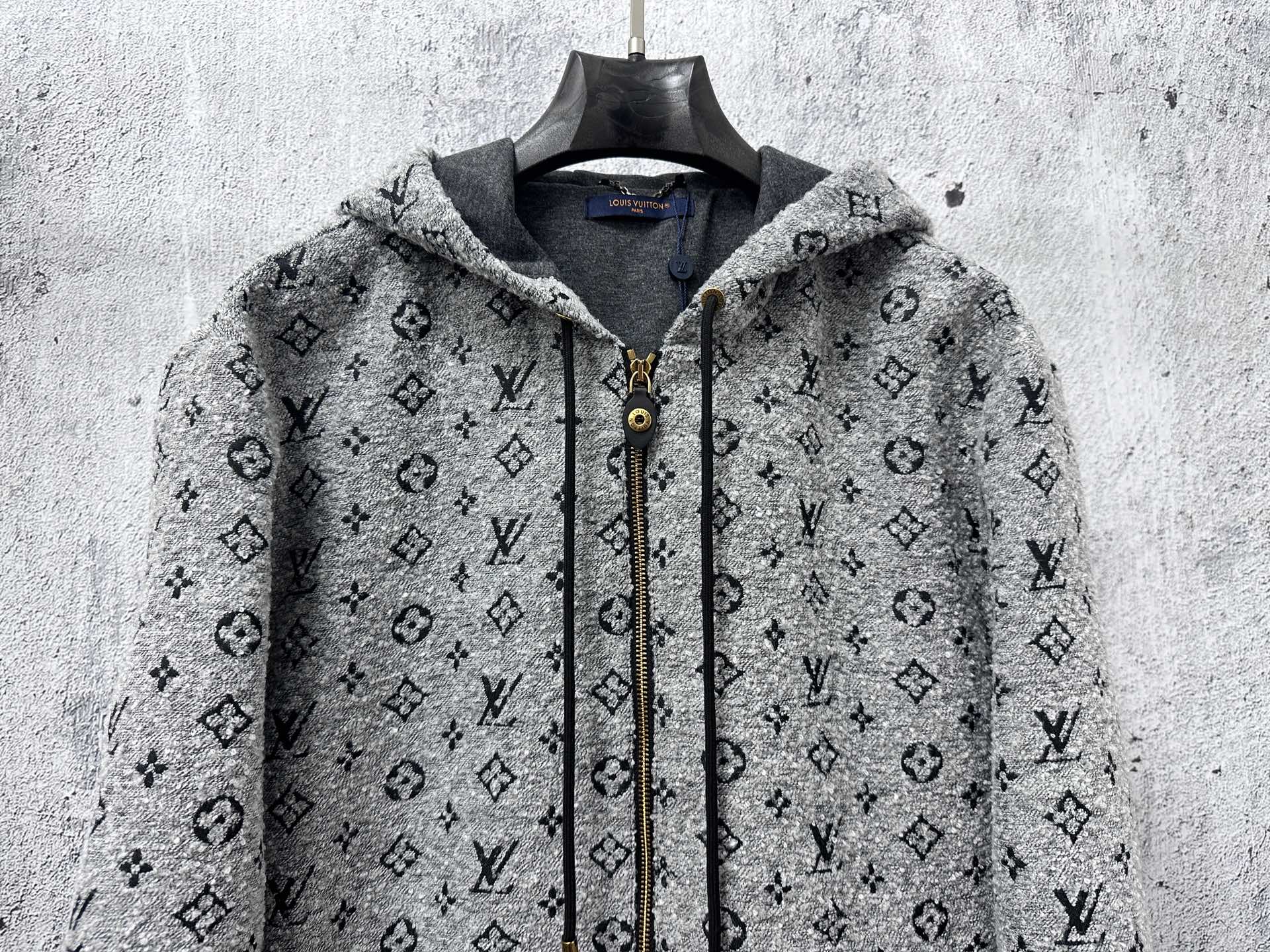 Louis Vuitton hooded full-zip jacket front view in dark gray monogram pattern
