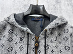 Louis Vuitton hooded jacket neckline close-up with gray lining, zipper, and monogram print