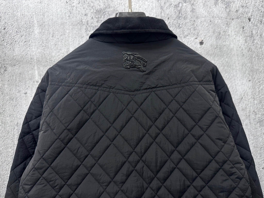 Burberry long quilted jacket back view with small crest logo above quilting
