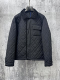 Burberry long quilted jacket with stand collar, button front, and chest pocket