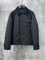 Burberry long quilted jacket with stand collar, button front, and chest pocket