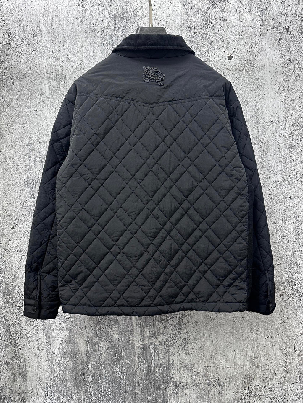 Burberry long quilted jacket, back view with raised logo and stand collar