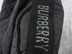 Burberry long jacket interior label text on dark fabric near zipper