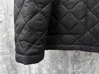 Prada quilted dark long jacket hem with pocket detail and diamond stitching