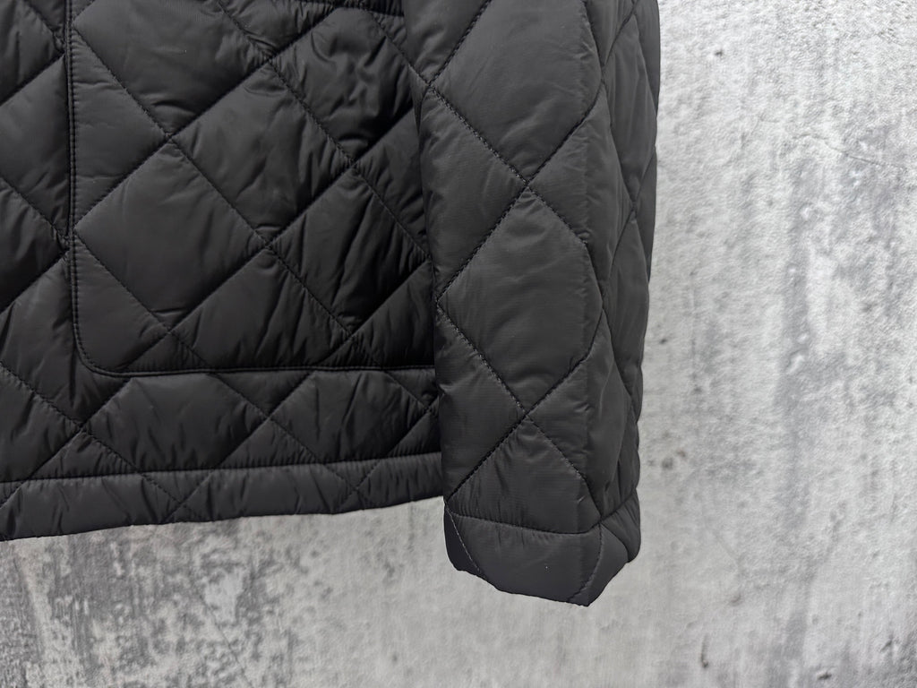 Prada quilted dark long jacket sleeve with cuff and stitched seam