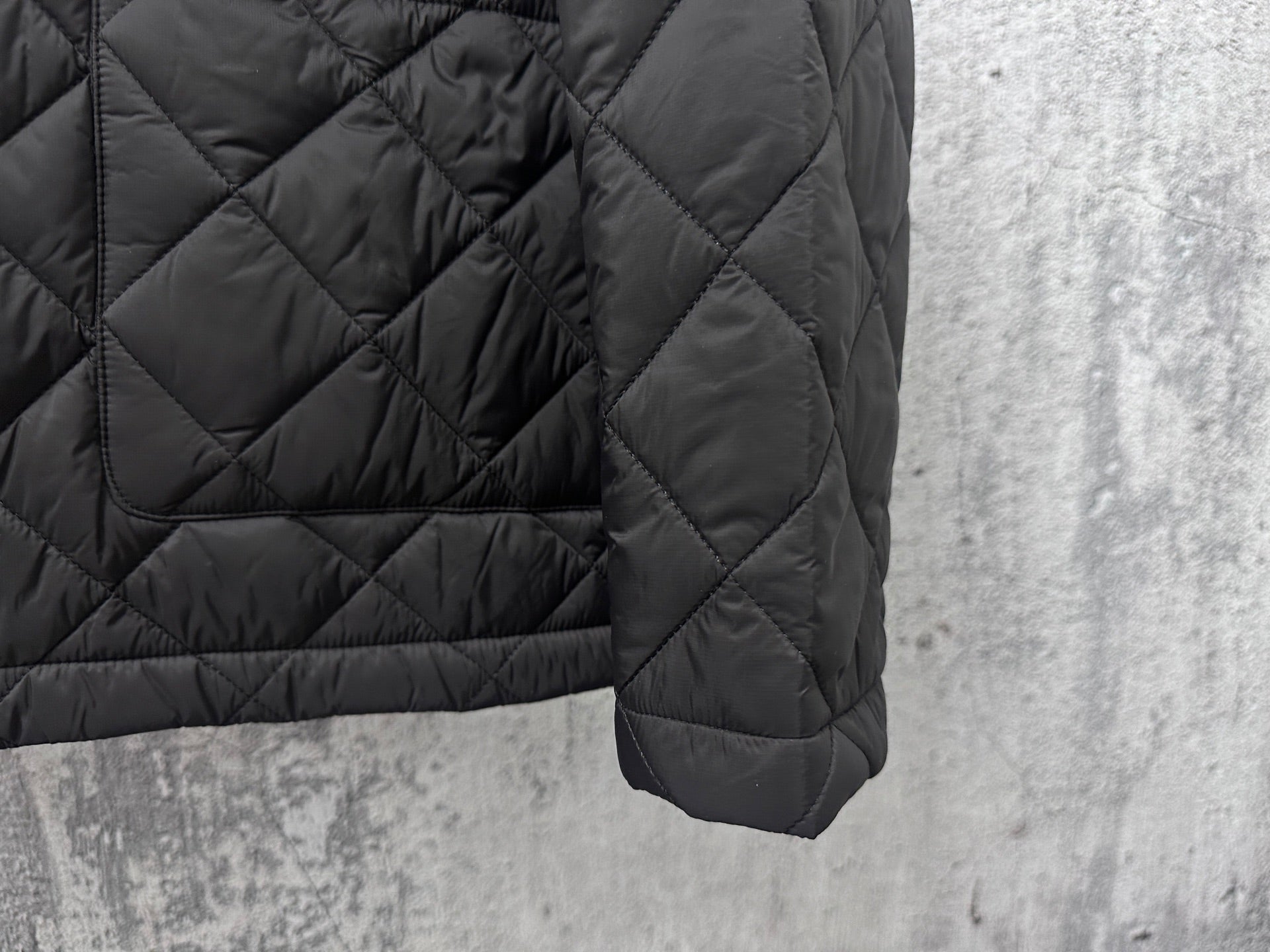 Prada quilted dark long jacket sleeve with cuff and stitched seam