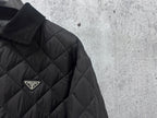 Prada logo badge on quilted dark black long jacket with diamond pattern