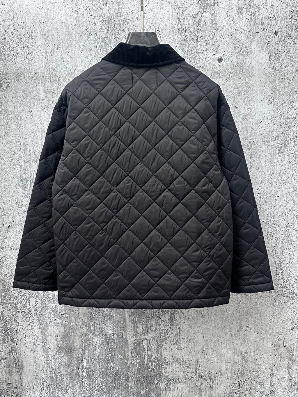 Prada quilted long jacket back in dark black with diamond stitching