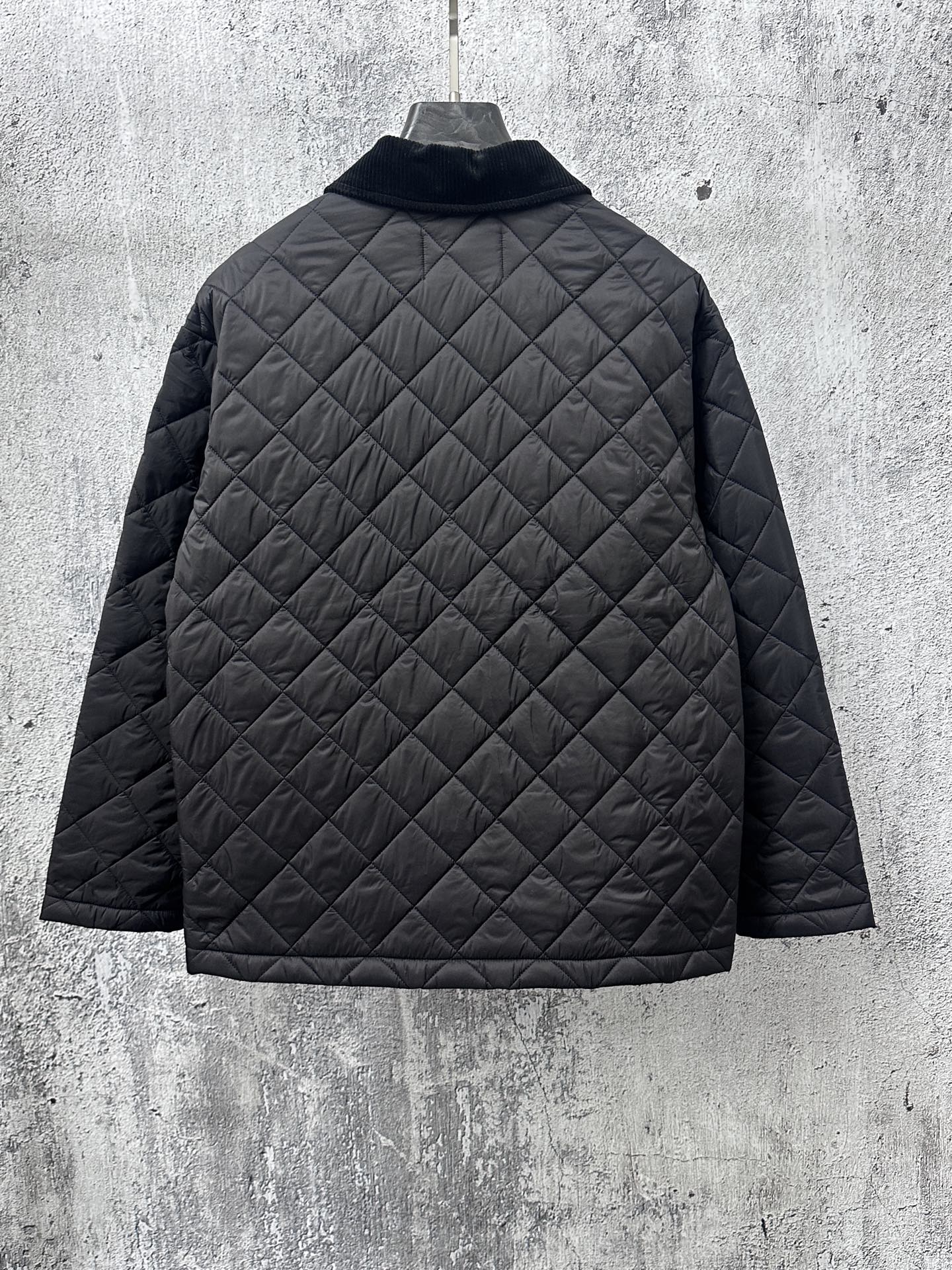 Prada quilted long jacket back in dark black with diamond stitching