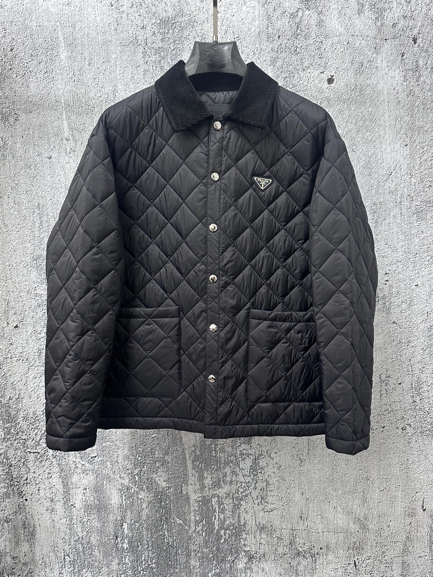 Prada quilted long jacket in dark black with snap buttons and stand collar