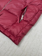 Prada red puffer jacket bottom hem with front zipper and stitched padding