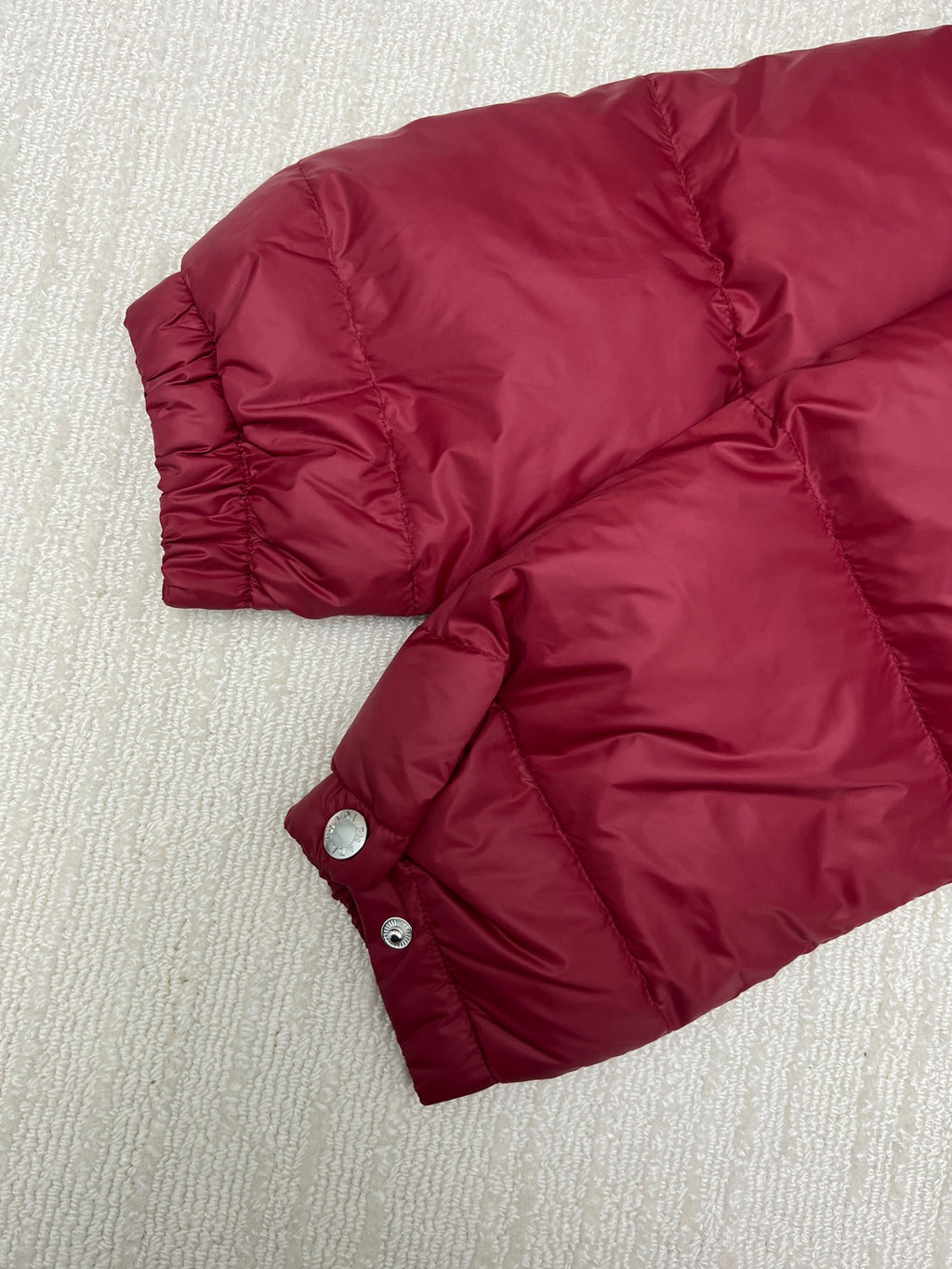 Prada long padded jacket, dark red with snap buttons and quilted sleeves