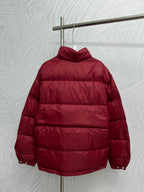 Prada red puffer jacket, back view with raised hood and padded panels